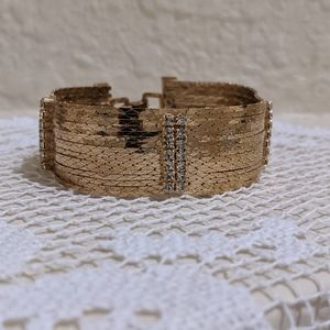 Gold bracelet with silver rhinestones